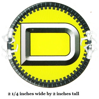 Circular object with yellow center and black and white border, labeled '2 1/4 inches wide by 2 inches tall'.