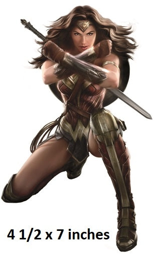 Superheroine in action pose with weapon, 4 1/2 x 7 inches